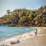 Aussie friend Jacqui takes a stroll on picturesque Jervis Bay