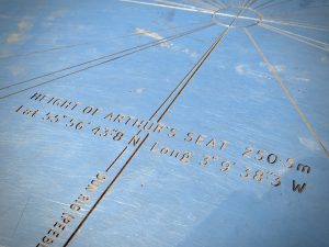 A closeup of the marker with the elevation (822 feet), longitude and latitude of Arthur's Peak in Edinburgh