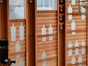 The cutouts in the walls of the Scottish Parliament debate chamber look like whiskey bottles but are actually meant to represent people looking in