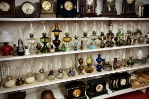 Antique oil lamps, clocks and rolling pins complement dozens of classic cars in Chanute museum