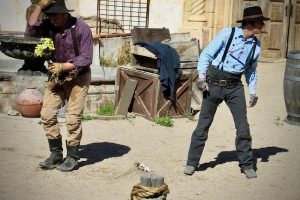 Slapstick stuntmen pause between faux punches in Old Tucson