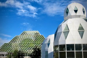 Living quarters, at right, flank the huge, glass-panelled indoor rainforest at Biosphere 2 in Oracle, Arizona