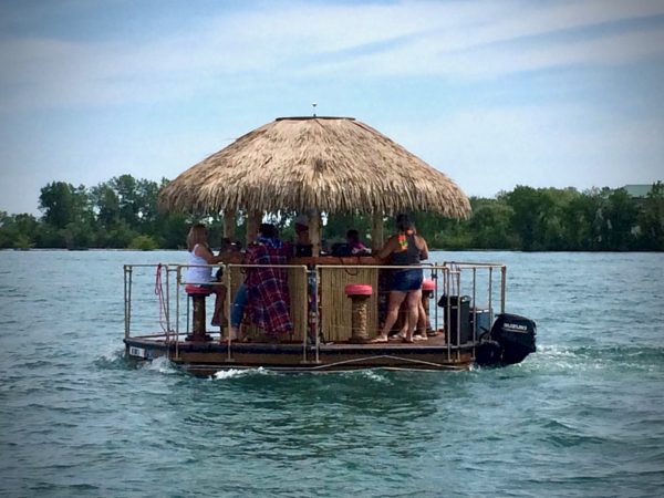 Only in America: an Aloha Tiki Tour bar boat chugs along the no wake zone