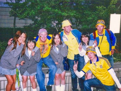 Super cute, always uniformed Japanese schoolgirls flash the ubiquitous peace sign outside Saitama Stadium