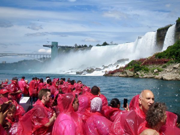 Red poncho clad tourists aboard the Hornblower at Niagara Falls, Ontario