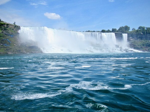 Tourists descend to the Niagara River on either side of the falls from the USA side